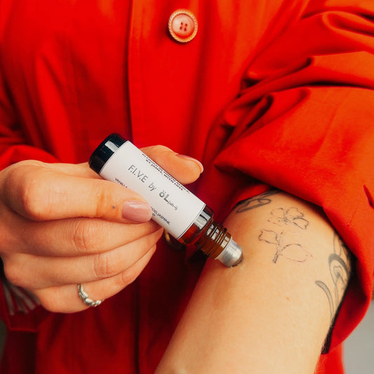 Product application shot of F.I.V.E by öL essential oil pure-fume.